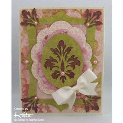 Card made with Cuttlebug Damask Frame Set
Products Used:
Cuttlebug Damask Frame Cut & Emboss Set
Madeline Patterned Paper
Studio K Shimmer Cardstock - Ivory
Spellbinders Big Scalloped Ovals - Large
May Arts Ivory Taffeta Ribbon
Pearls - Rose
