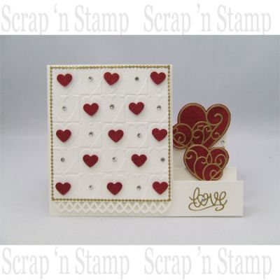 Card Made with Cuttlebug Heart Blocks Embossing Folder
Products Used:
Cuttlebug Heart Blocks Embossing Folder
Tonic Studios Punch - Heart
Outline Stickers - Swirly Hearts
Studio K Regal Red Opaque Glitter
